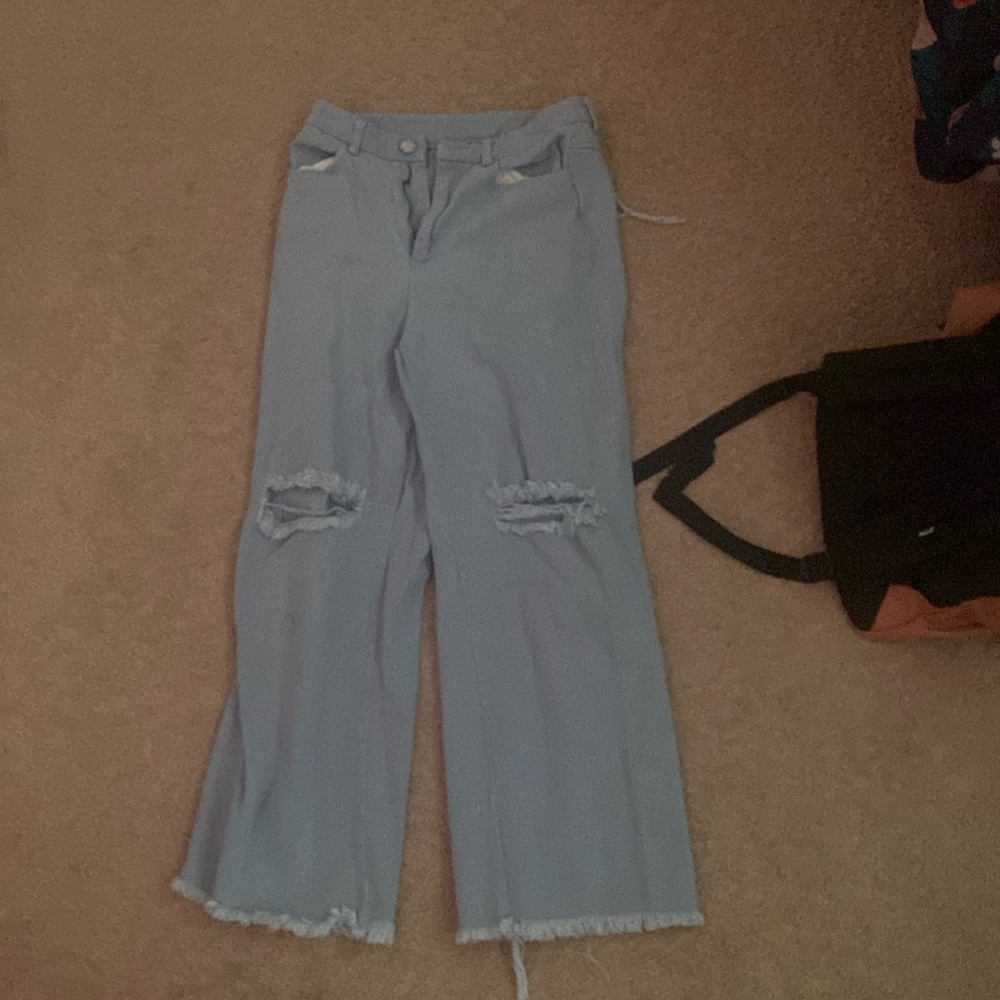 light wash baggy ripped jeans